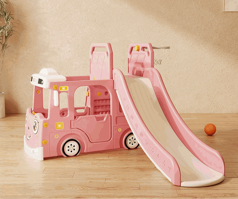 Speeltoestel Peuter Busje robuust roze met glijbaan en basketbalring voor binnen en buitengebruik.